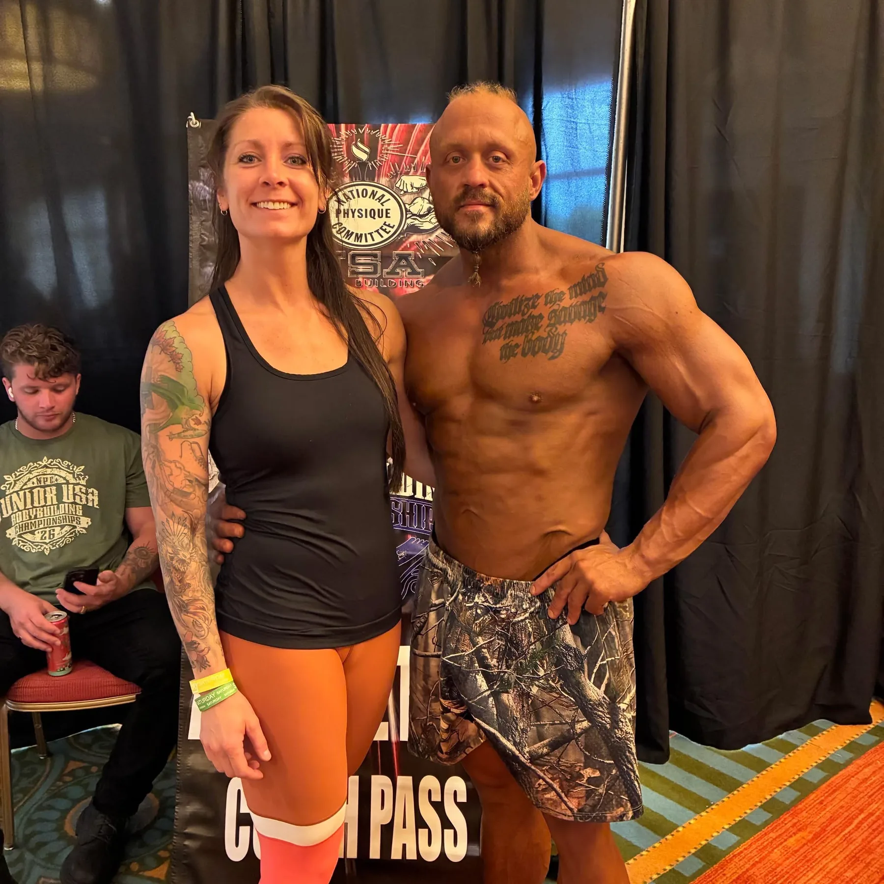 Derek Cundiff with a bodybuilding athlete at an NPC event