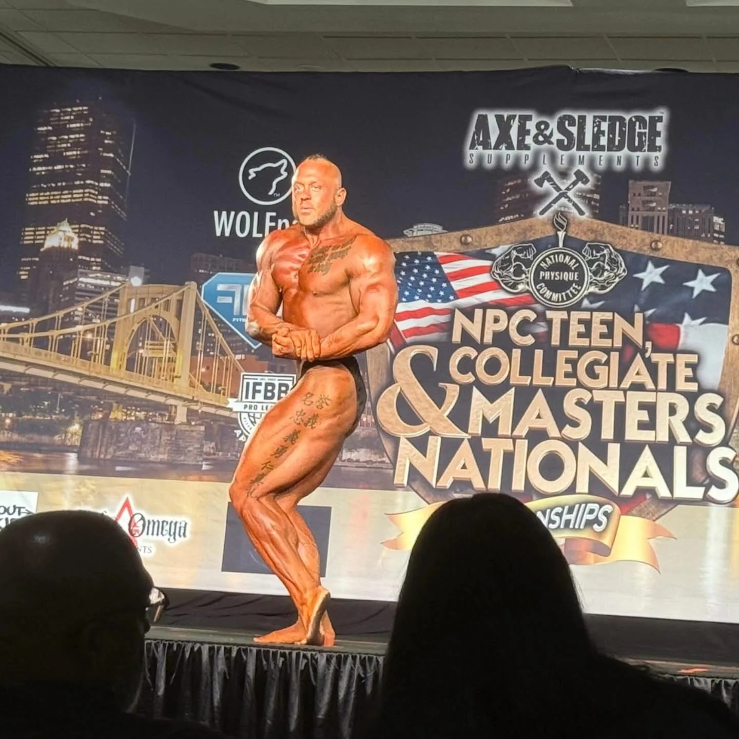 Derek Cundiff performing a side chest pose at NPC Masters Nationals